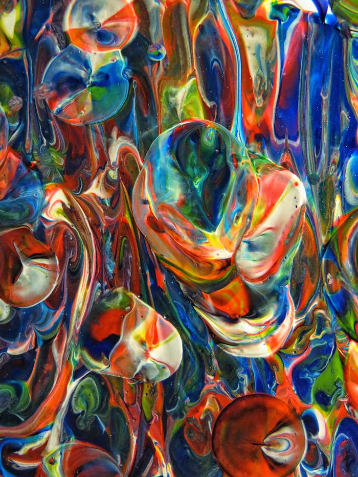 Vibrant abstract acrylic painting with swirling colors and fluid textures creating a dynamic visual experience.